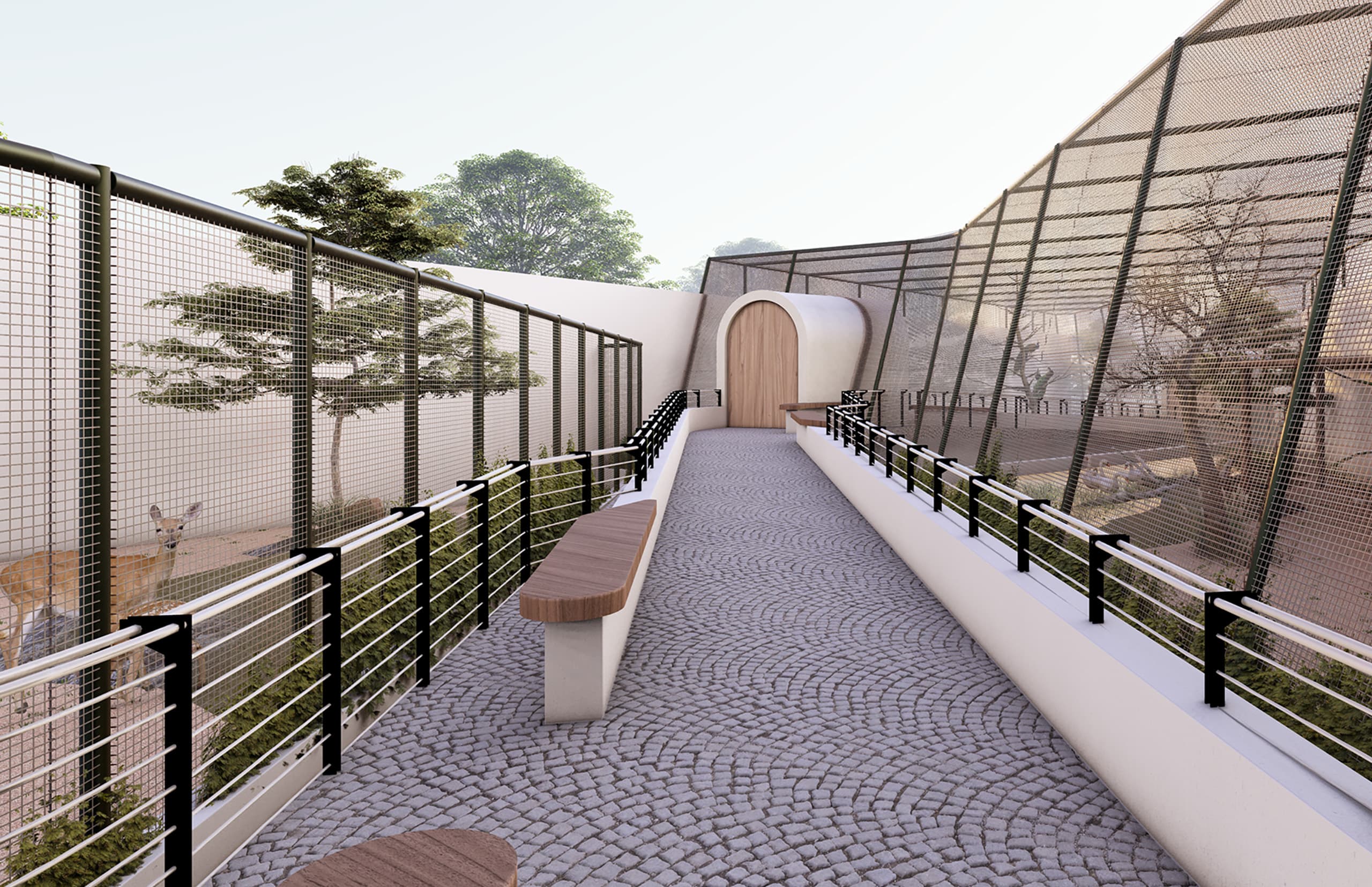 The final viewpoint captures the exit promenade, where the cobblestone walkway curves gently beneath the sheltering canopy. Dappled sunlight filters through the trees, softening the concrete geometry and enriching the sense of calm. The transparent fencing maintains clear sightlines to the adjacent aviary, while benches provide quiet resting spots before departure. This closing moment embodies the essence of Budoor Zoo — a seamless blend of architecture, landscape, and light that turns a compact urban edge into a serene natural retreat.