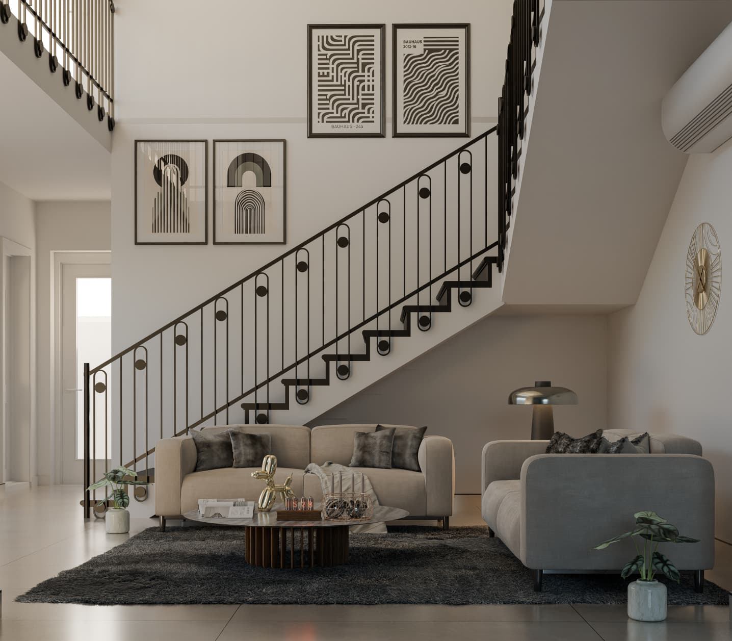 This interior view presents the main living space as a double-height or visually extended volume connected to the stair. The layout prioritizes openness and visual continuity, allowing natural light to penetrate deep into the space. The staircase acts as a dominant architectural feature, contributing both function and spatial identity, while the neutral material palette keeps the focus on proportion and layout rather than decoration.