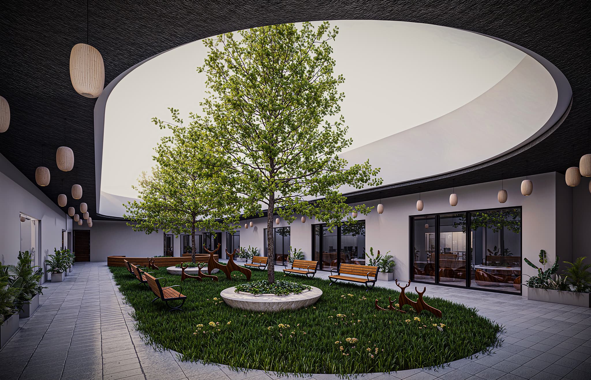 The inner courtyard shifts the experience from playful exterior to peaceful retreat. A large circular opening in the roof bathes the garden in natural light, nurturing a tree at its center — a living symbol of growth. Surrounding classrooms open directly onto this space, connecting children to nature. Soft lighting, benches, and organic details create a calm, sensory-rich atmosphere for exploration and rest.