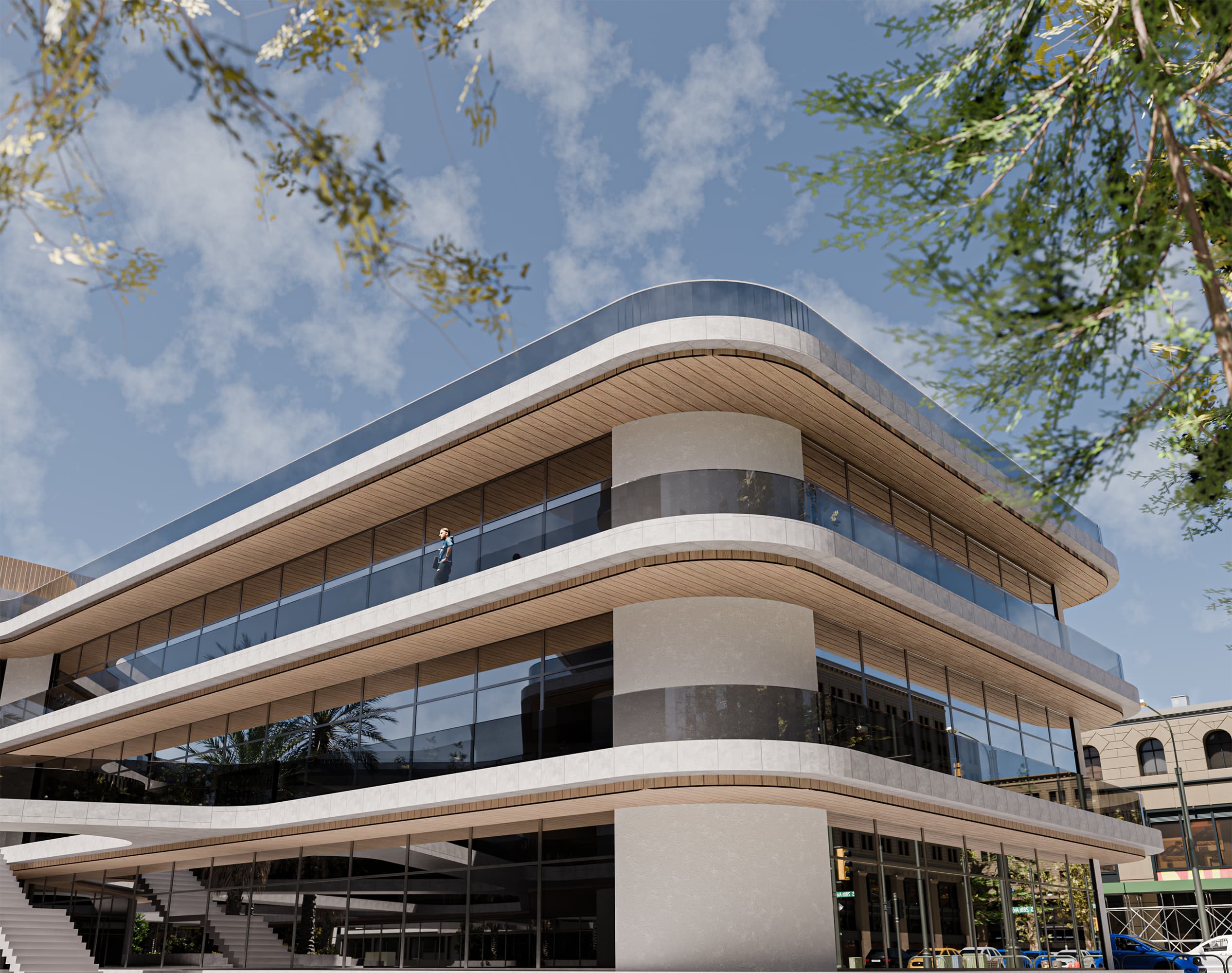 At street level, the building projects openness and approachability. Large glass panels reveal interior activity, while rounded corners soften its urban presence. The modern yet welcoming facade makes the school a civic landmark rooted in transparency and connection.